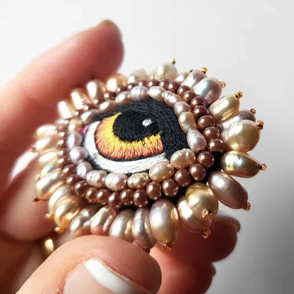 Broche oog amber