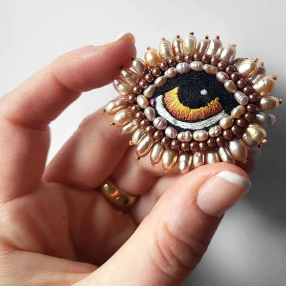 Broche oog amber